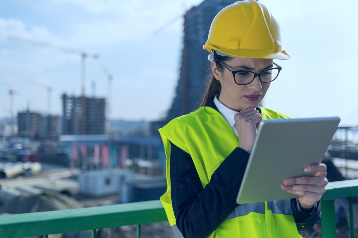 Young female architect managing construction site